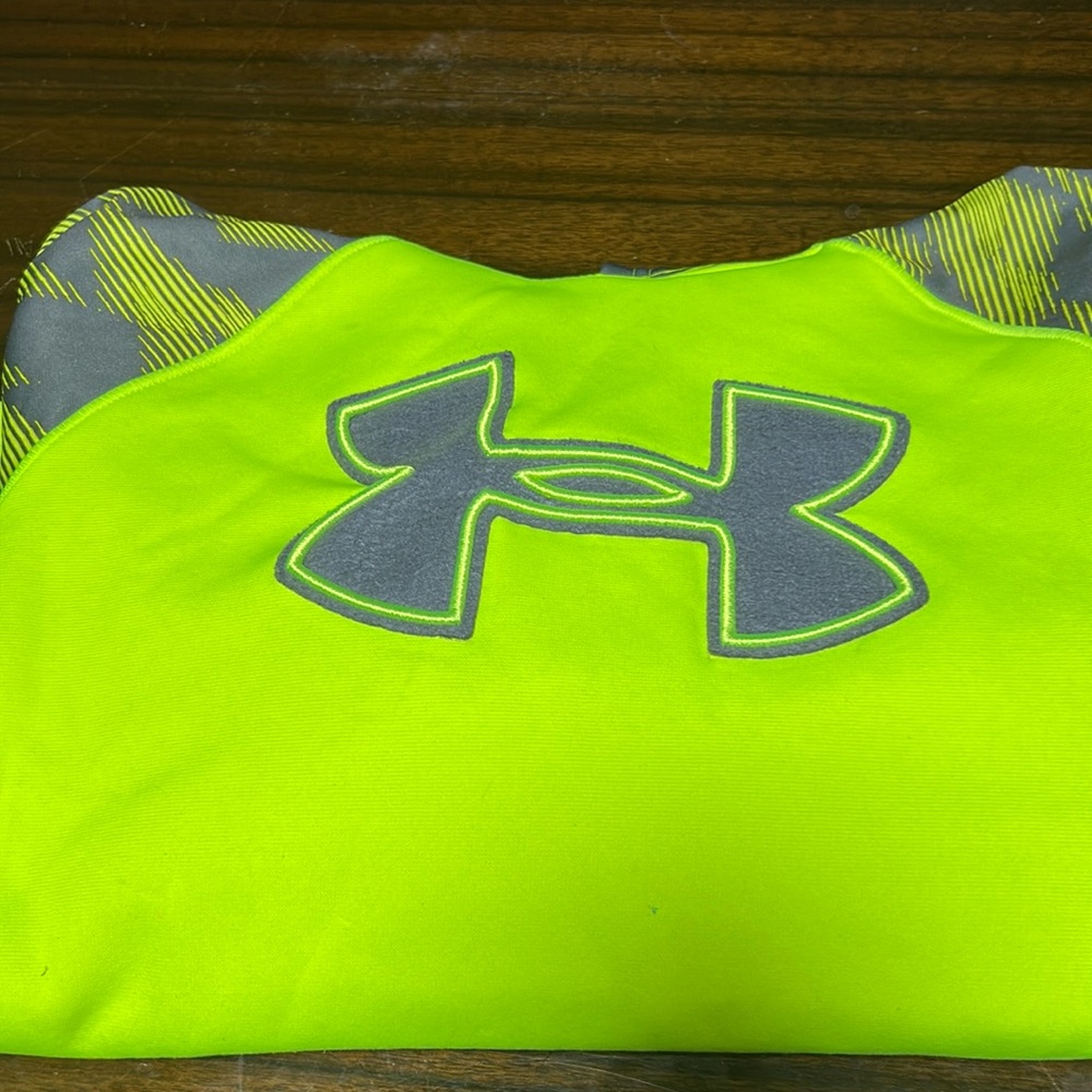 boys large yellow under armor sweatshirt. Has some marks and signs of wear.
